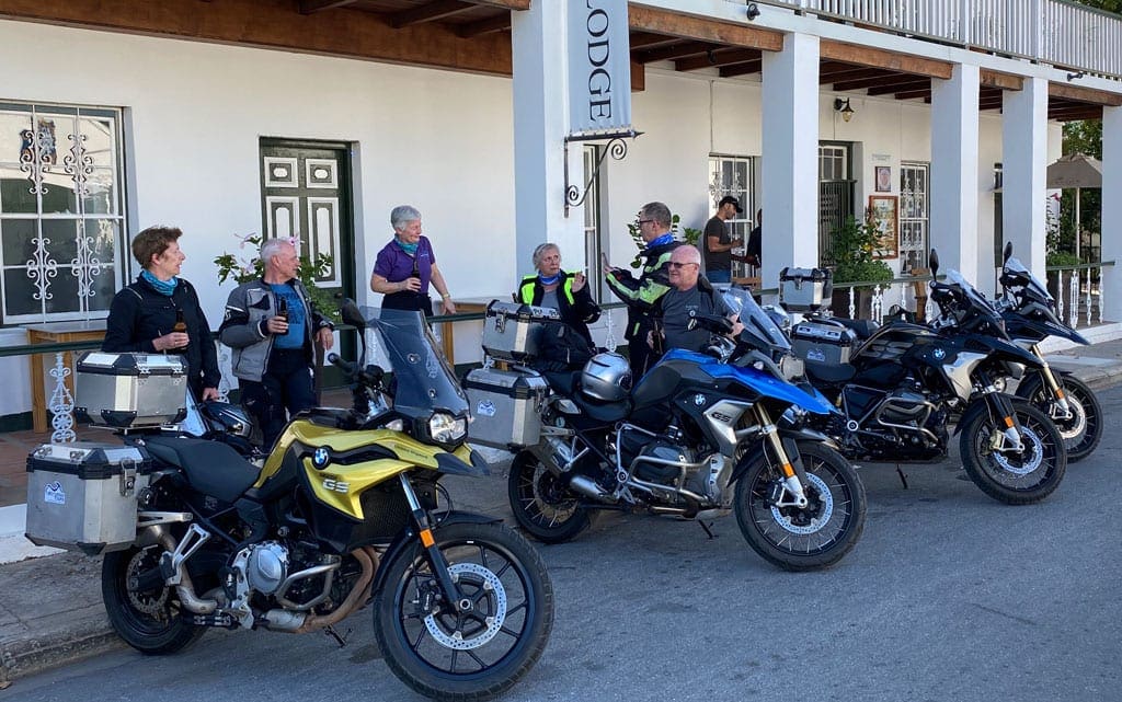 Leaving the city 4 The group have a beer and a chat whilst standing next to their bikes.