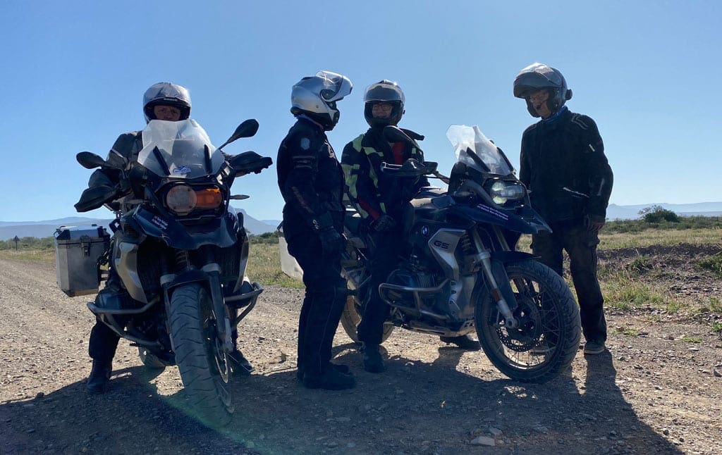 The group stop for a discussion along a straight road.