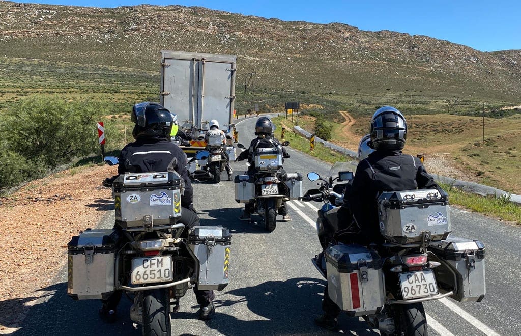 The group get stuck behind a couple of lorries.