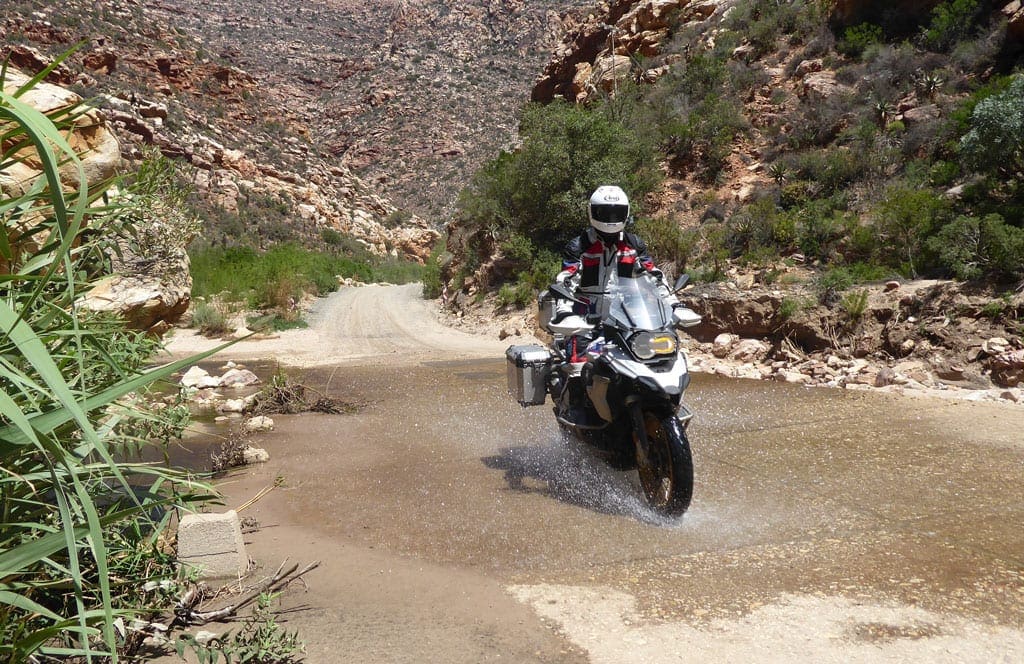Dirt roads 3 One of the bikers riding over a ford.